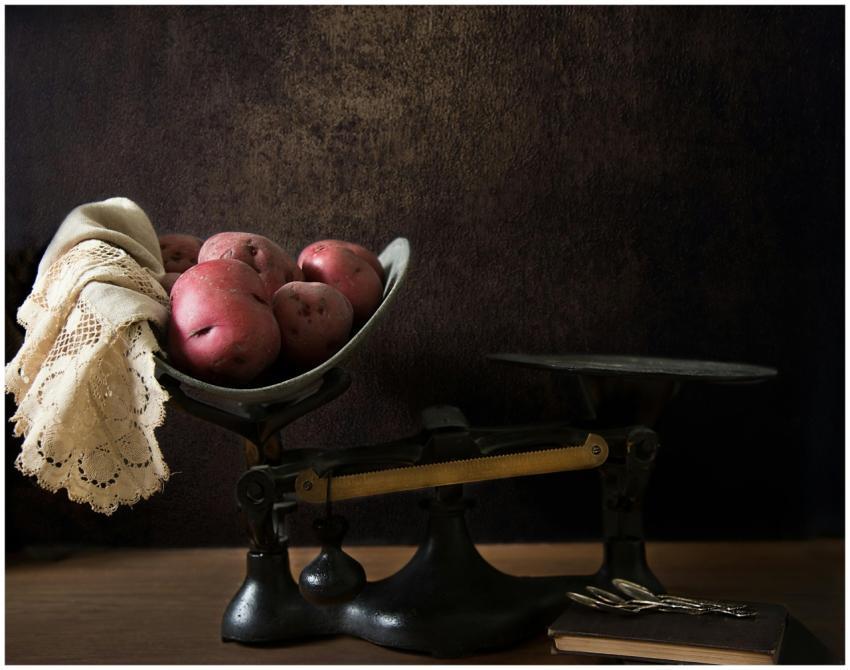 Vintage balance scale with red potatoes and lace c