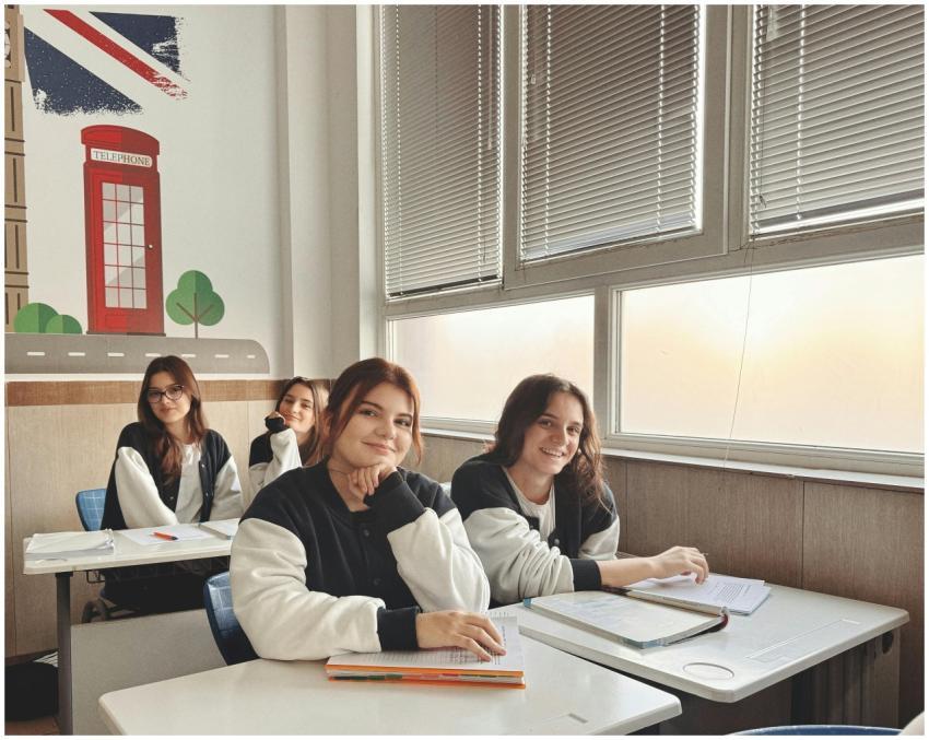 Group of students in a classroom with British deco