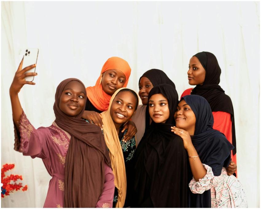 A group of young women in colorful clothing happil