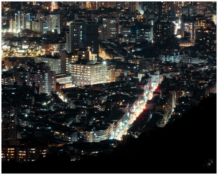Aerial view of a vibrant city illuminated with lig