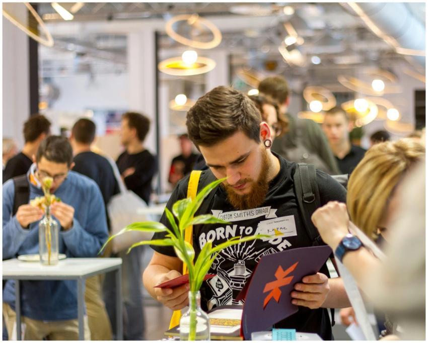 Group of young professionals networking in a moder