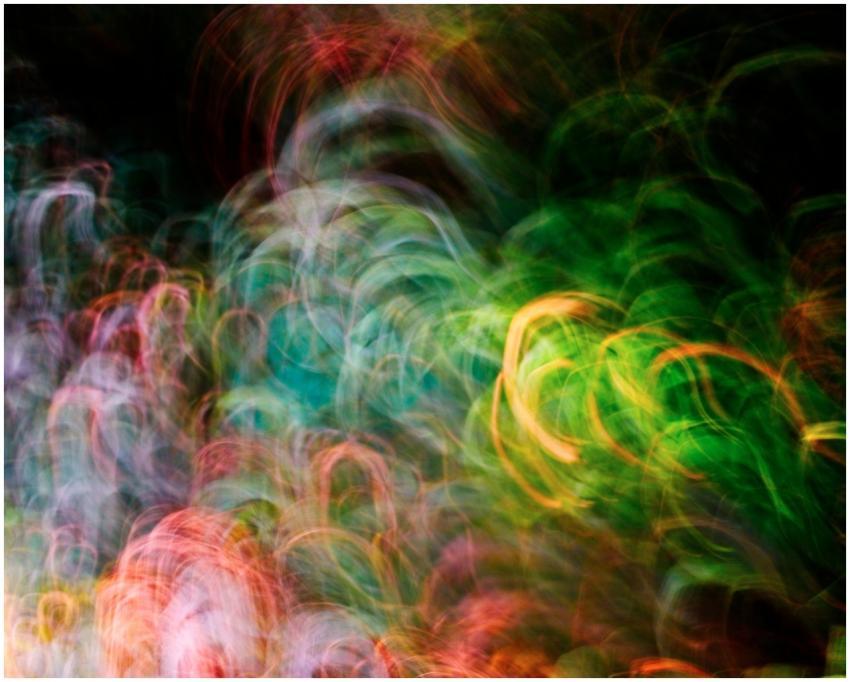 Vibrant swirling colors and light patterns create