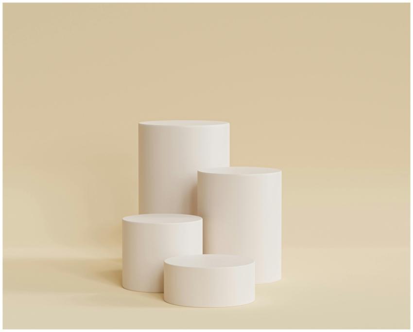 Elegant beige cylindrical podiums for a sleek and
