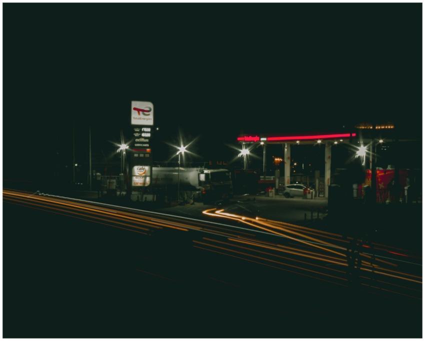 Gas station illuminated at night with bright light