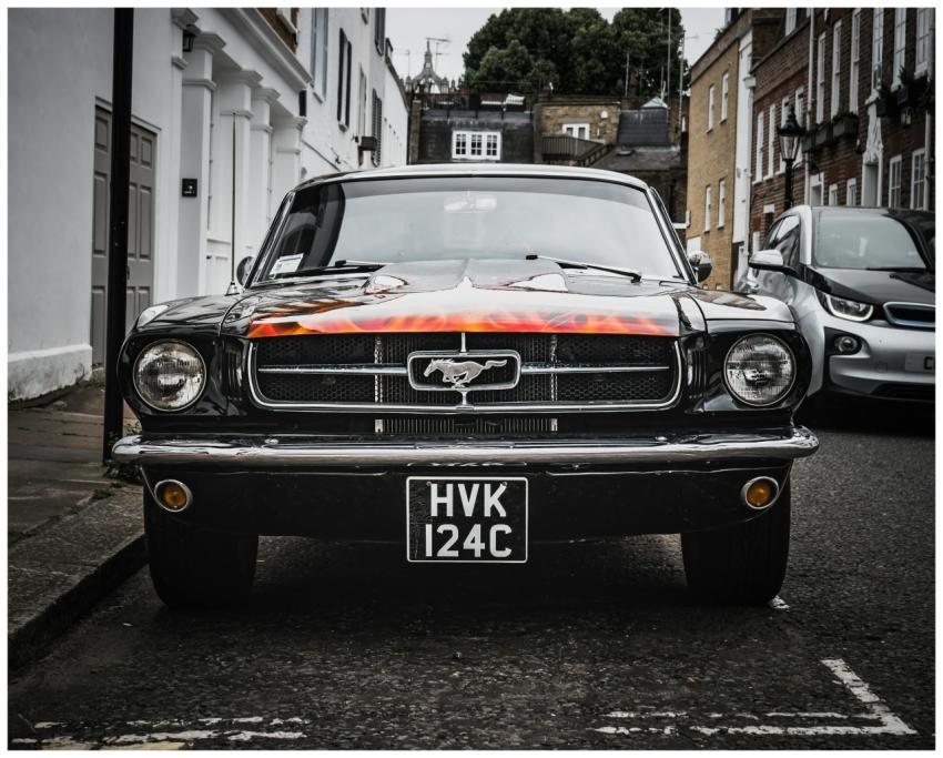 Front view of a vintage Ford Mustang parked on a L