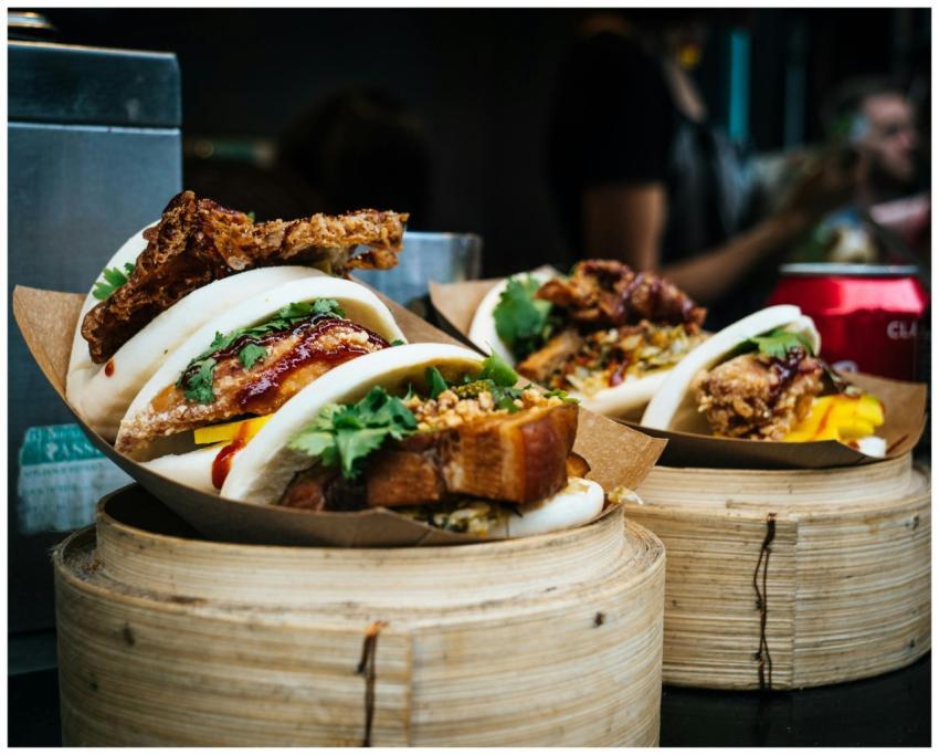 Tasty bao buns with meat and vegetables, captured