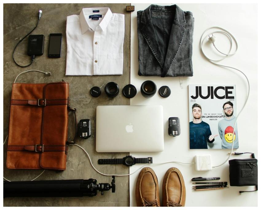 Neatly arranged travel essentials for men includin