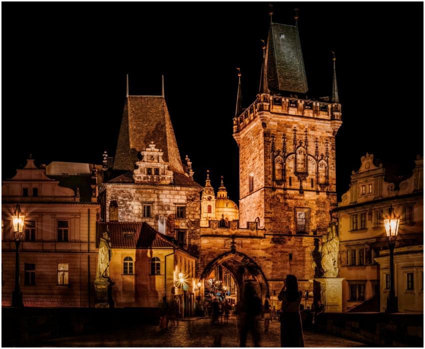 A beautifully lit Gothic building in Prague at nig