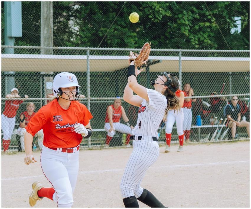 Energetic scene of teenage girls playing softball