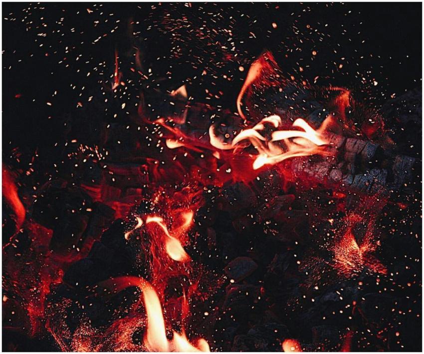 Dynamic close-up of red flames and sparks, showcas