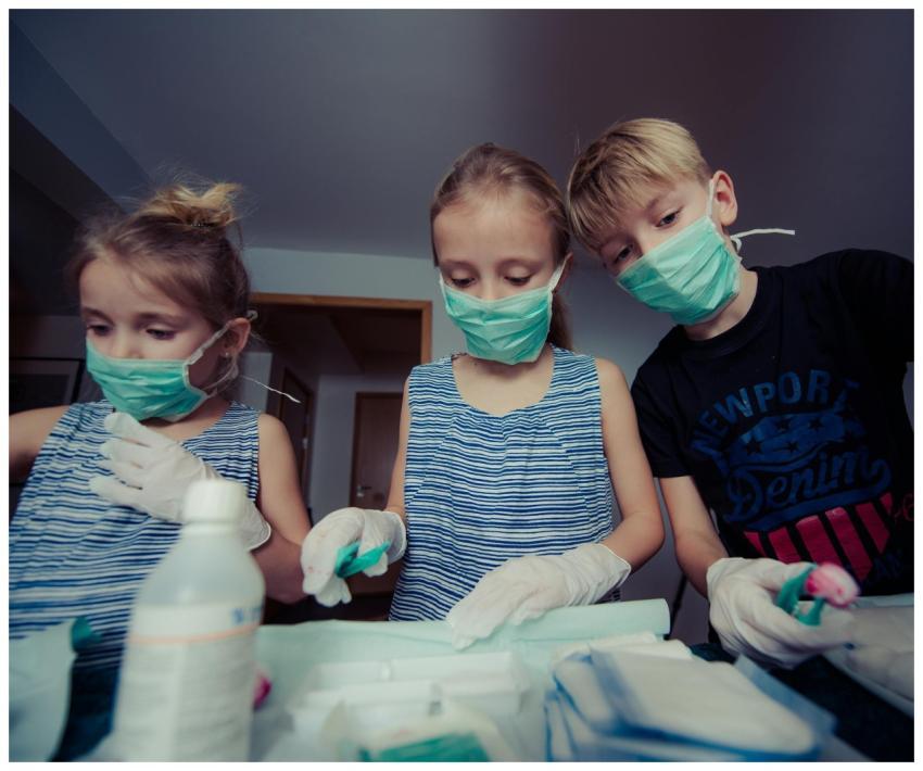 Children pretending to be doctors in a playful ind