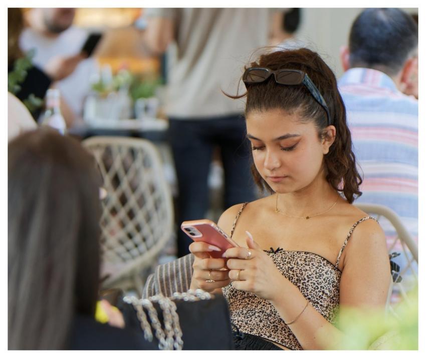 Girlie Looking Phone Sitting