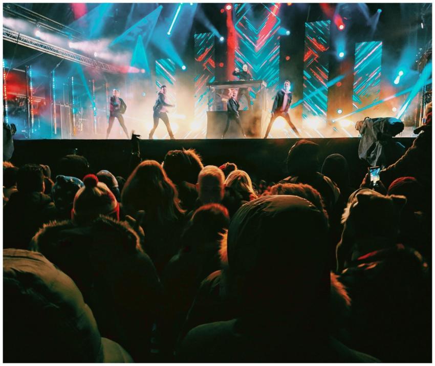 Energetic concert crowd enjoying a nighttime perfo