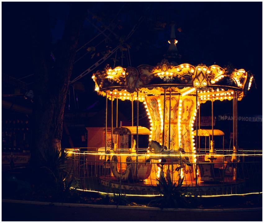 An enchanting view of a brightly lit carousel in a