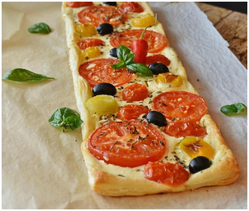Delicious vegetarian tart topped with fresh tomato