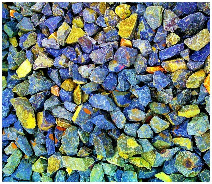 Vibrant blue and yellow gravel stones creating a t