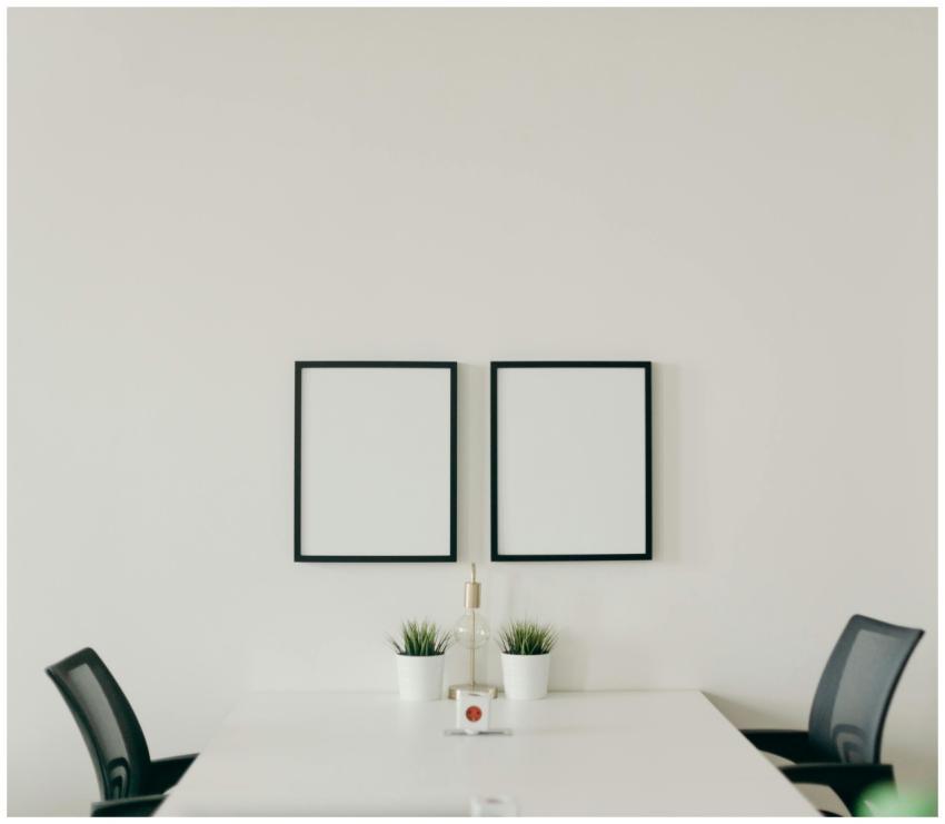 Elegant minimalist home office with white desk, bl