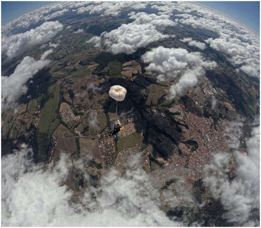 Stunning aerial shot of a skydiver descending thro