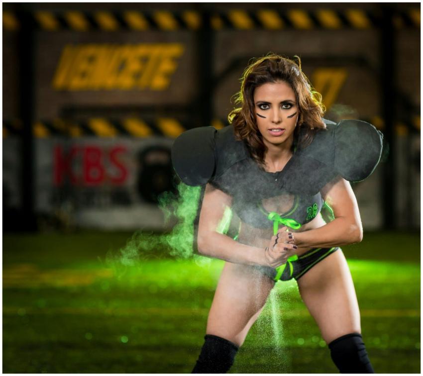 Energy-packed shot of a female athlete on a footba