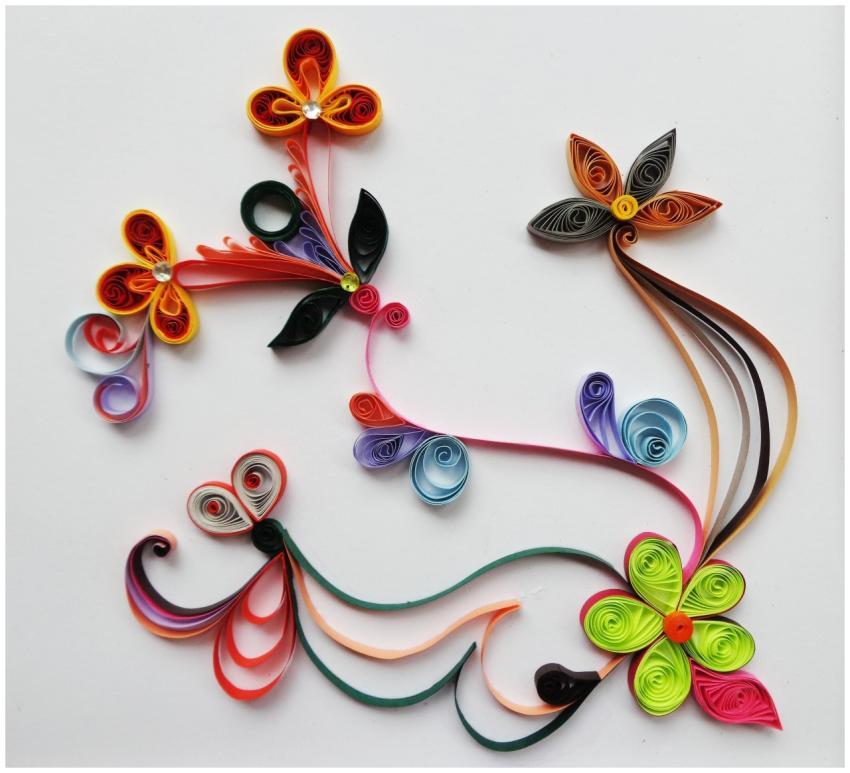 Colorful paper quilling floral design creating a v