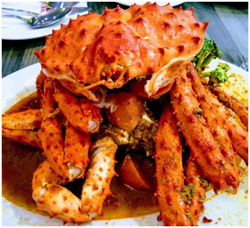 Mouth-watering crab dish garnished with broccoli,