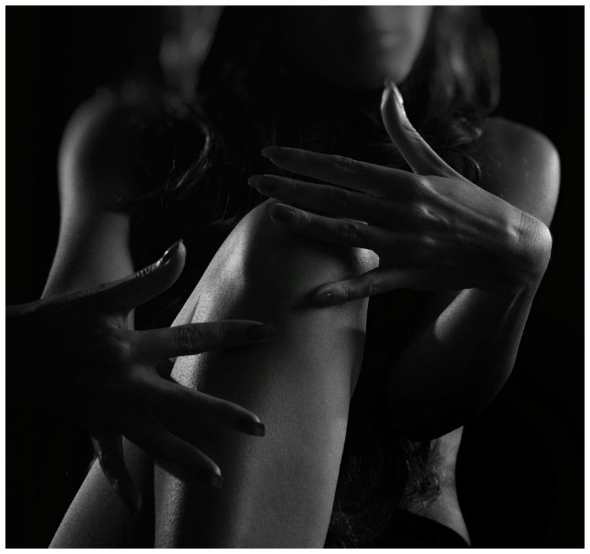 Dramatic black and white silhouette of a woman's h