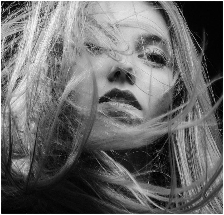 Artistic black and white portrait capturing a woma