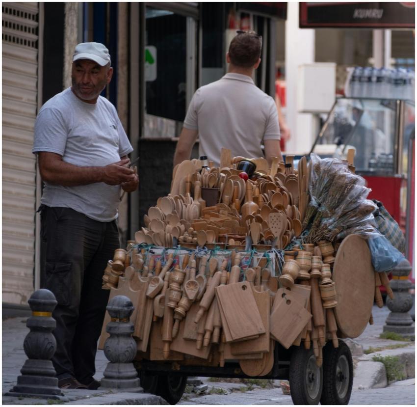 Explore handmade wooden utensils at a street stall