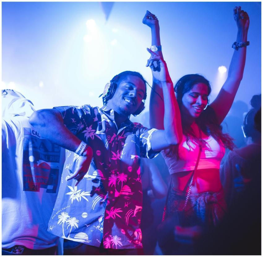 Vibrant nightclub scene with people dancing energe