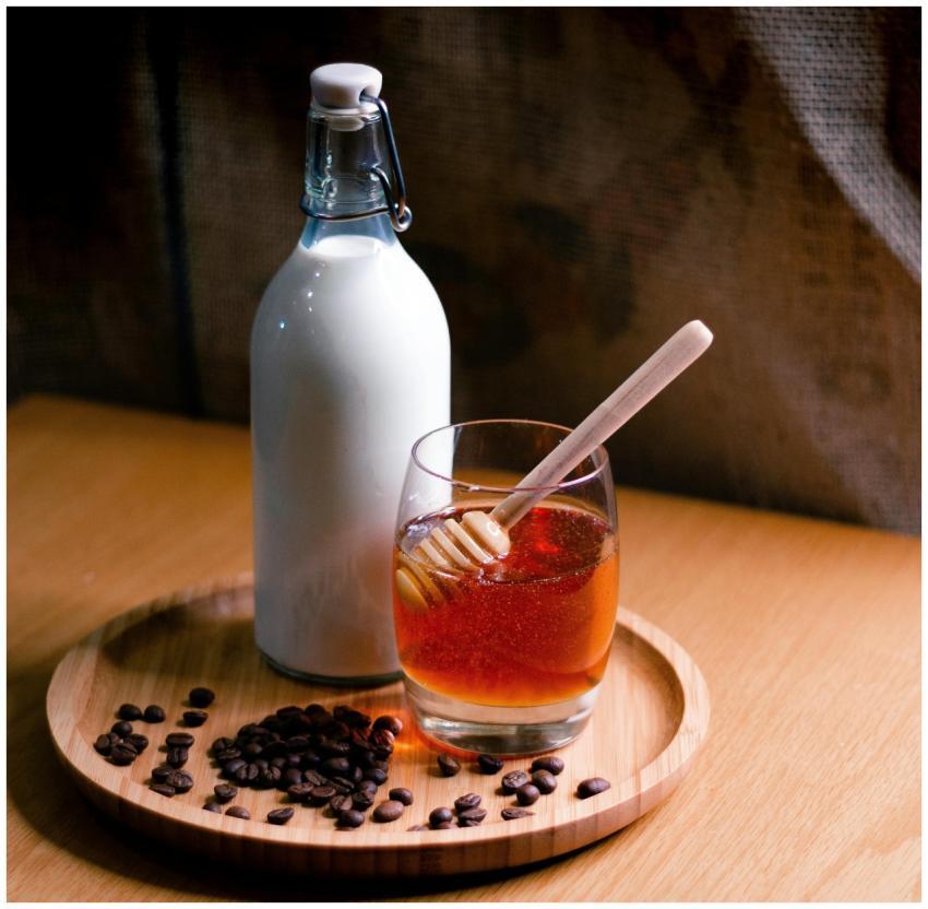 Elegant setup featuring a milk bottle and honey gl