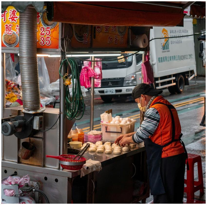 A street vendor prepares traditional dumplings at