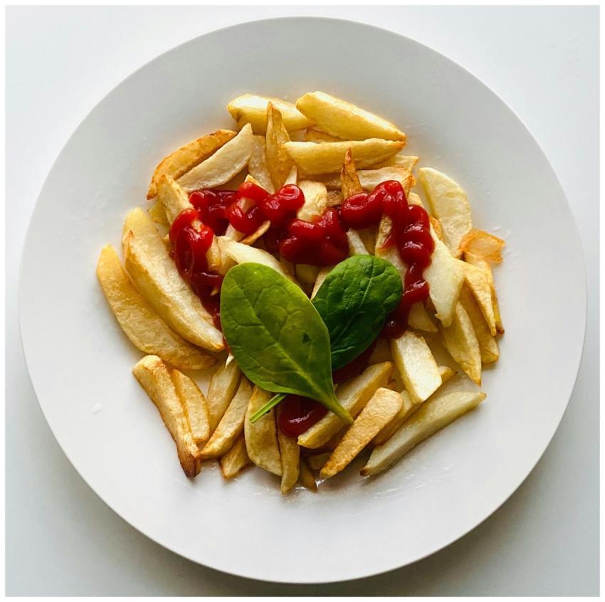 Delicious crispy french fries served with ketchup