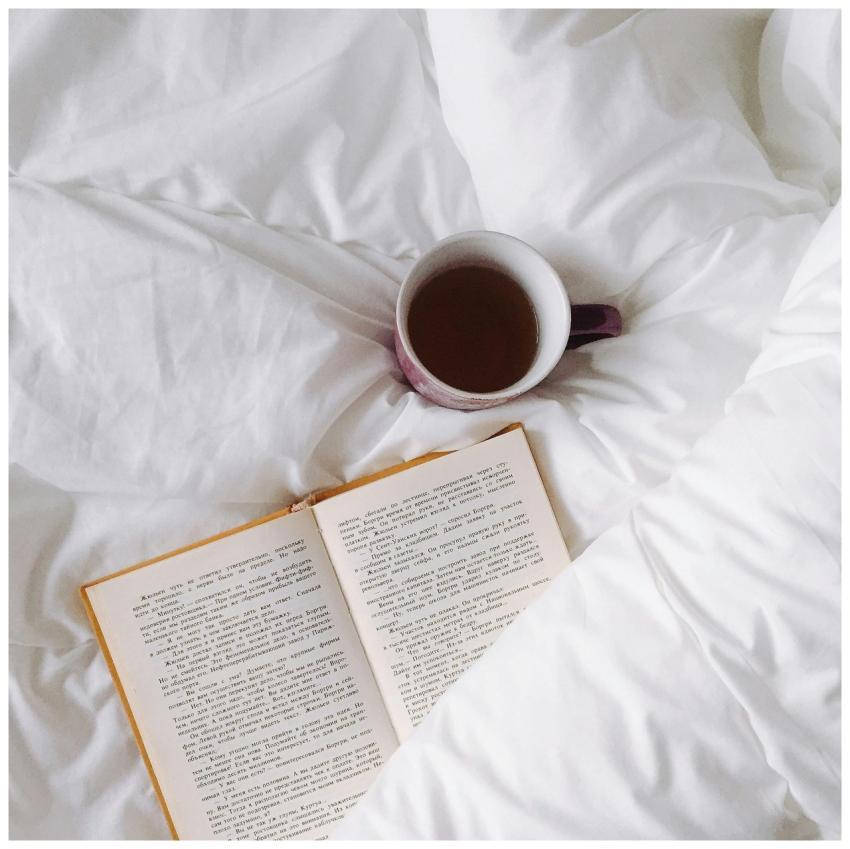 An inviting setup with a warm cup of tea and open