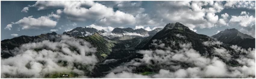 Panoramic view of a majestic mountain range with a