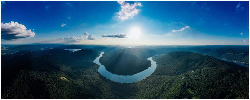 Stunning aerial view of a lush river bend surround