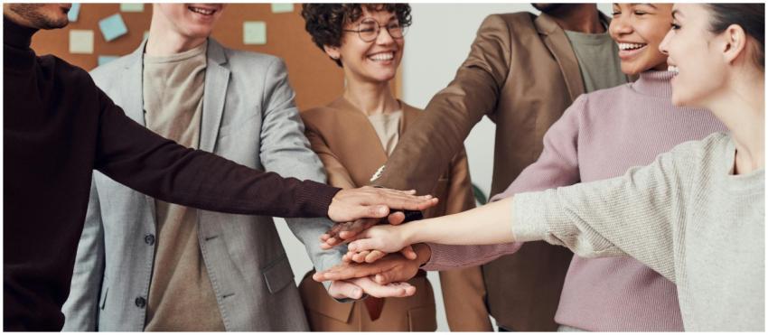 A group of happy, diverse colleagues celebrating t