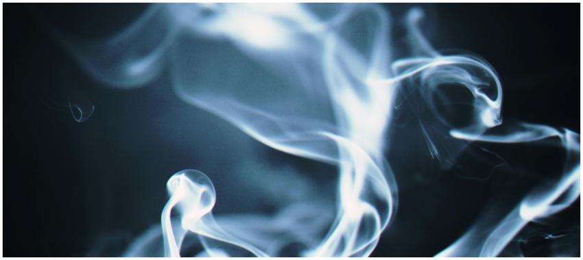 Artistic close-up of swirling white smoke against