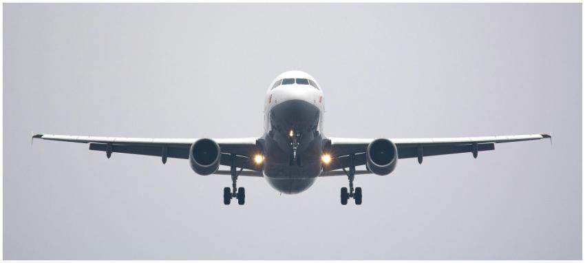 A commercial airliner captured head-on, preparing