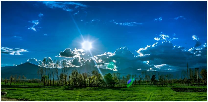 Scenic view of Kalam's green fields and dramatic s