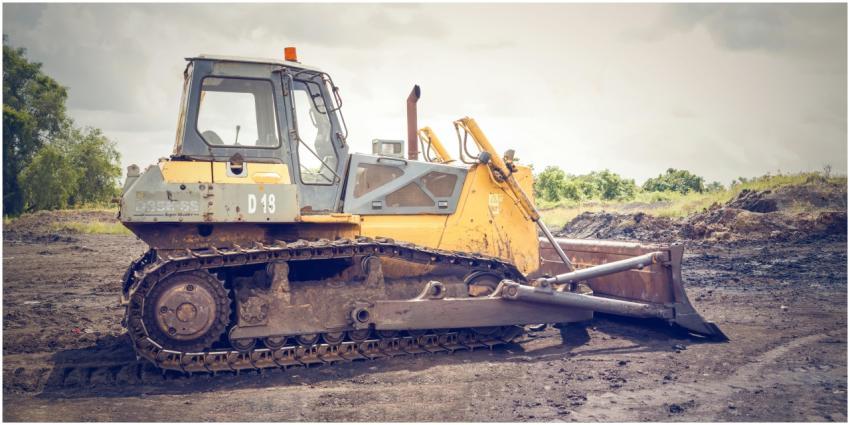 A powerful bulldozer on muddy construction ground