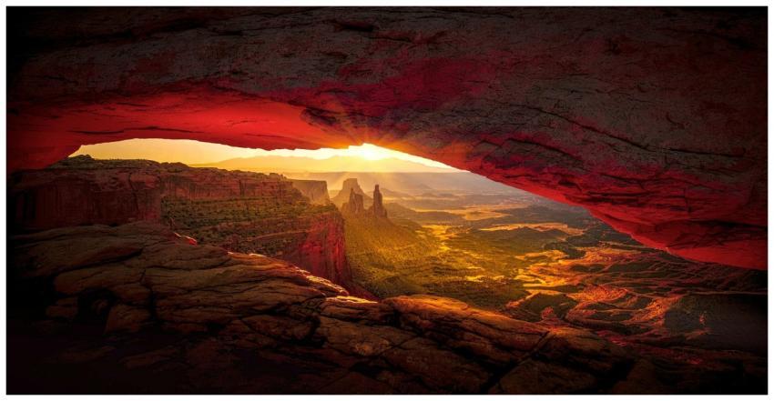 Captivating sunrise view through Mesa Arch in Cany