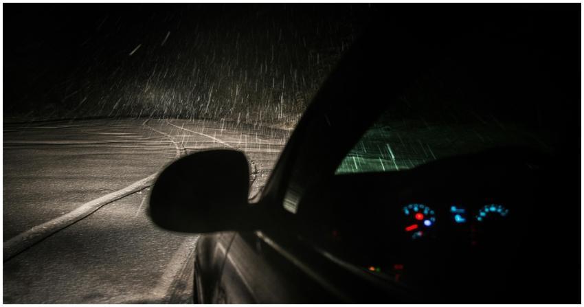 Capture of a car driving through a snowstorm at ni