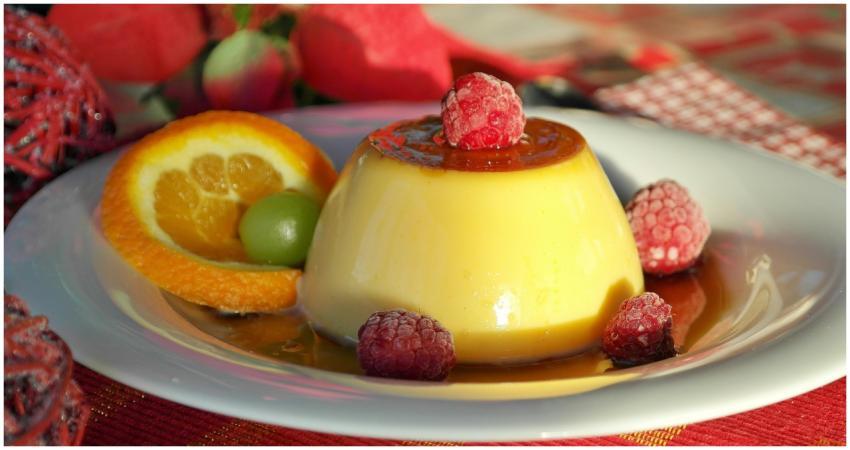 Indulge in creamy flan topped with raspberries, pa