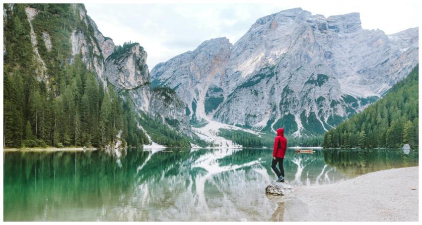 Person standing by the scenic Lake Braies with maj