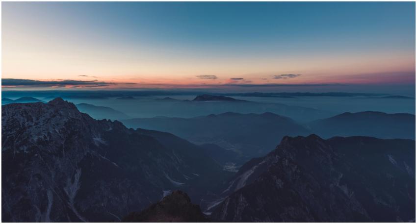 Stunning aerial view of misty mountains at twiligh
