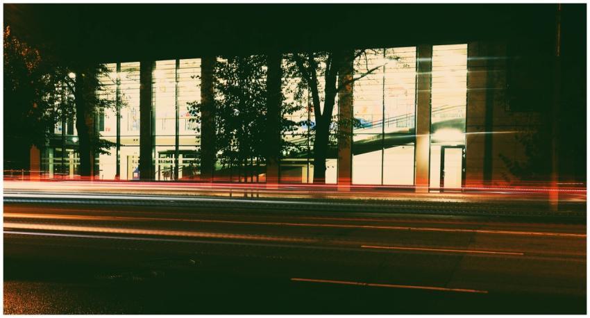 Vibrant night cityscape featuring light trails and