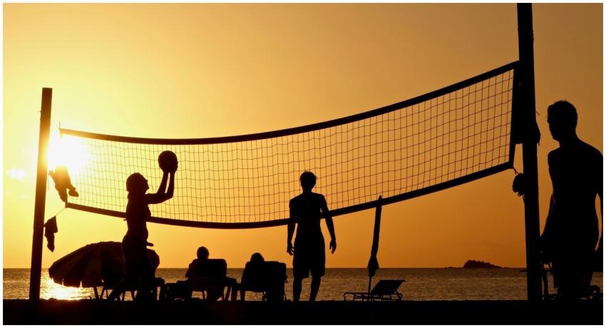 Silhouettes playing volleyball on Antigua's beach