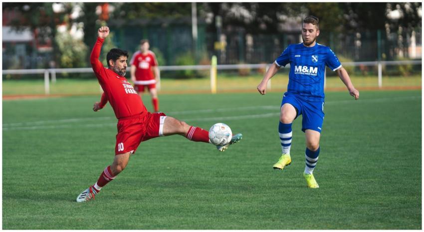 Players in vibrant uniforms compete in a dynamic s