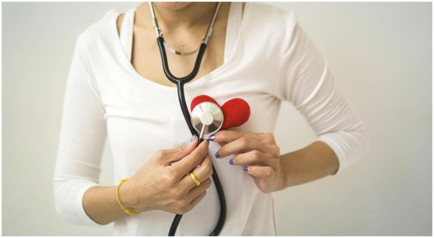 Unrecognizable female wearing white shirt while st