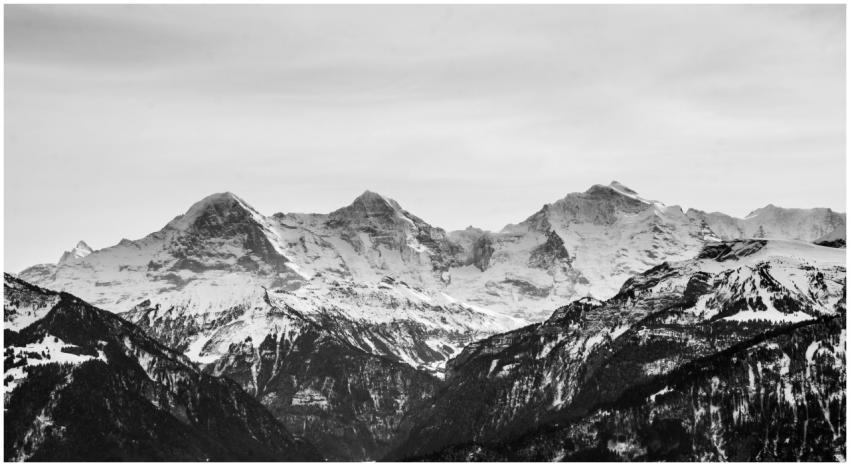 Black and white photo capturing majestic, snow-cap